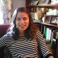 Ashlee Paxton-Turner in front of a bookshelf