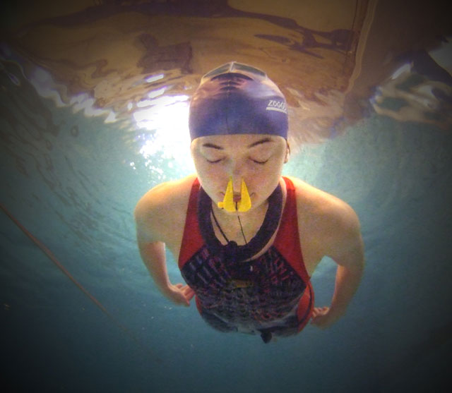 resistance, woman swimming underwater