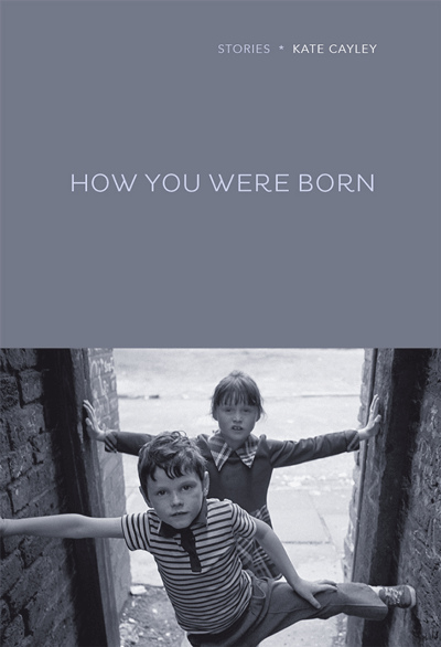 How You Were Born cover art. A black-and-white photograph of two children standing in a dooway