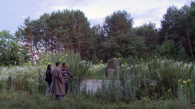 Andrei is taken to a mass grave of Jews killed on the spot in WWII.