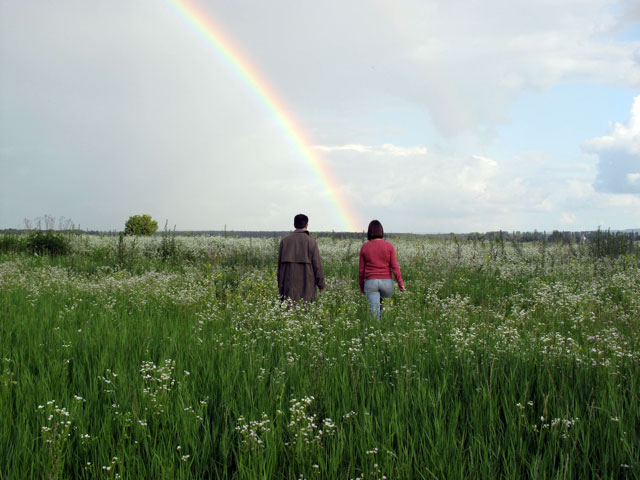 Andrei and his guide Alyona Andronati walk the rich fields of Western Ukraine.