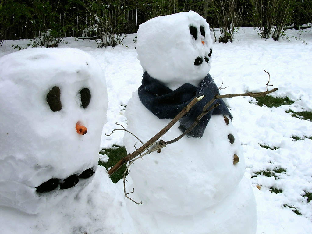Two snowmen holding hands