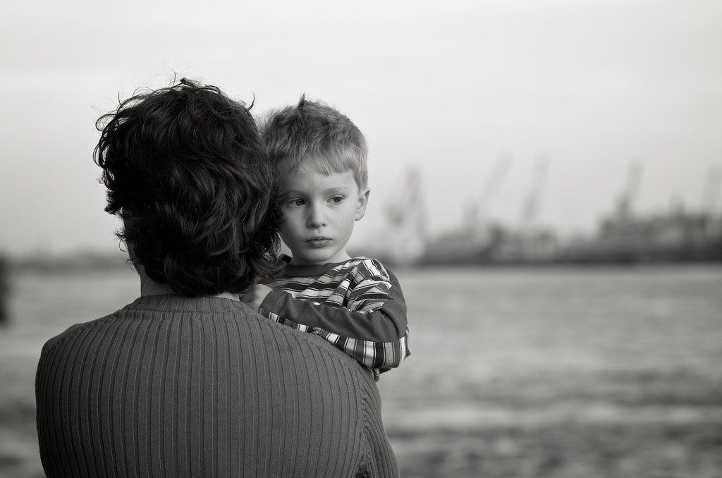 Seeking-Childhood, black and white photo of man holding child