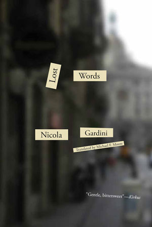 Lost Words cover art. A heavily blurred photograph of a city block