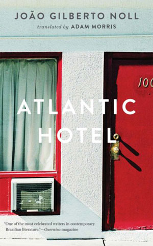 Atlantic Hotel cover art. A photo of the outside of a hotel room--a white wall, a window, and a red door
