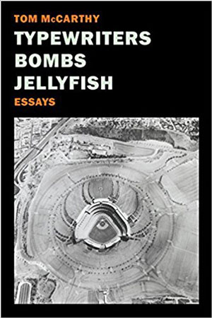 Typewriters Bombs Jellyfish cover art. A bird's eye view of a baseball stadium surrounded by fields of dirt