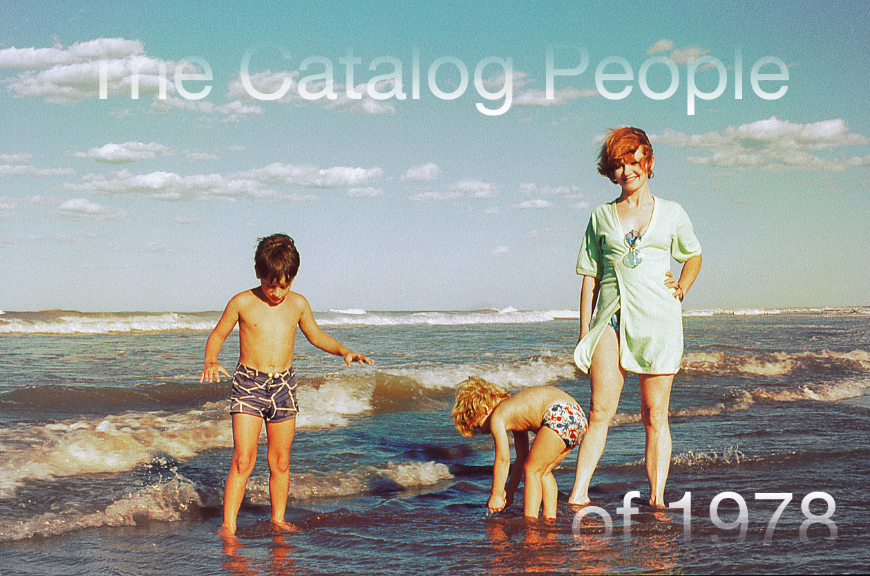 A woman standing next to two children dipping their toes in the ocean, with the title of the piece faded into the borders