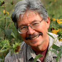 Headshot of Walter Bargen in a field of flowers