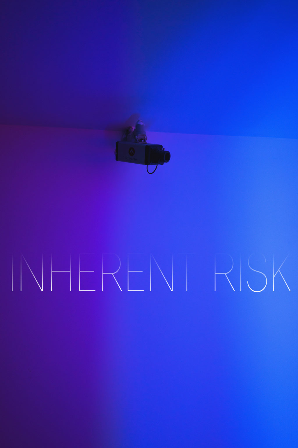 Security camera fastened to the ceiling surrounded by blue and purple lighting, with the title of the piece in the center of the image