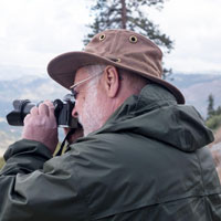 Profile shot of Robert Lietz taking a photo with his camera