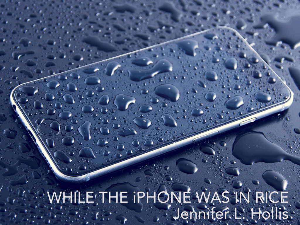 iPhone on a wet surface, covered in drops of water, with the title of the piece on the bottom of the photo