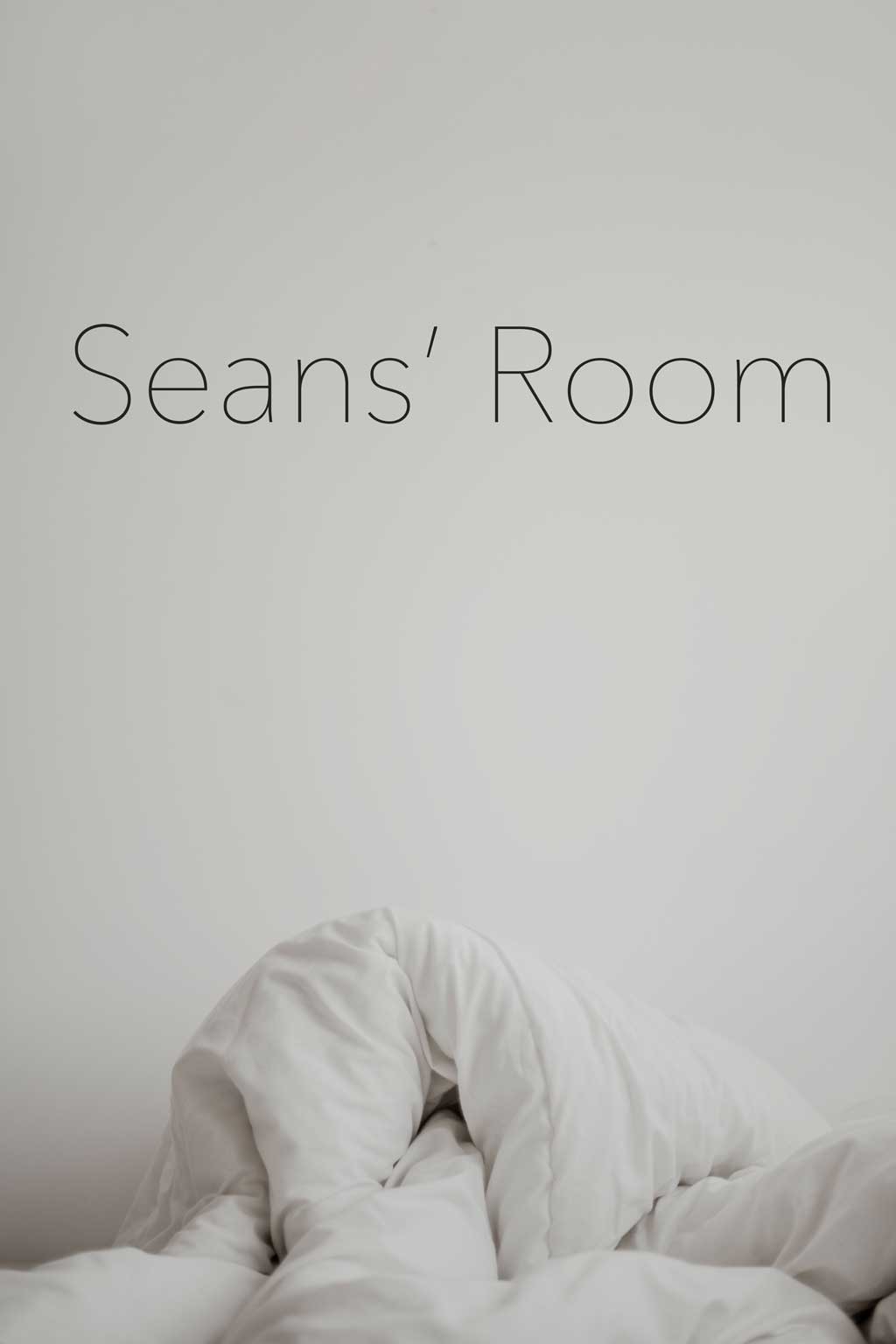 Photograph of white crumpled bed sheets, with the title of the piece, "Sean's Room," in plain black font at the top of the photo