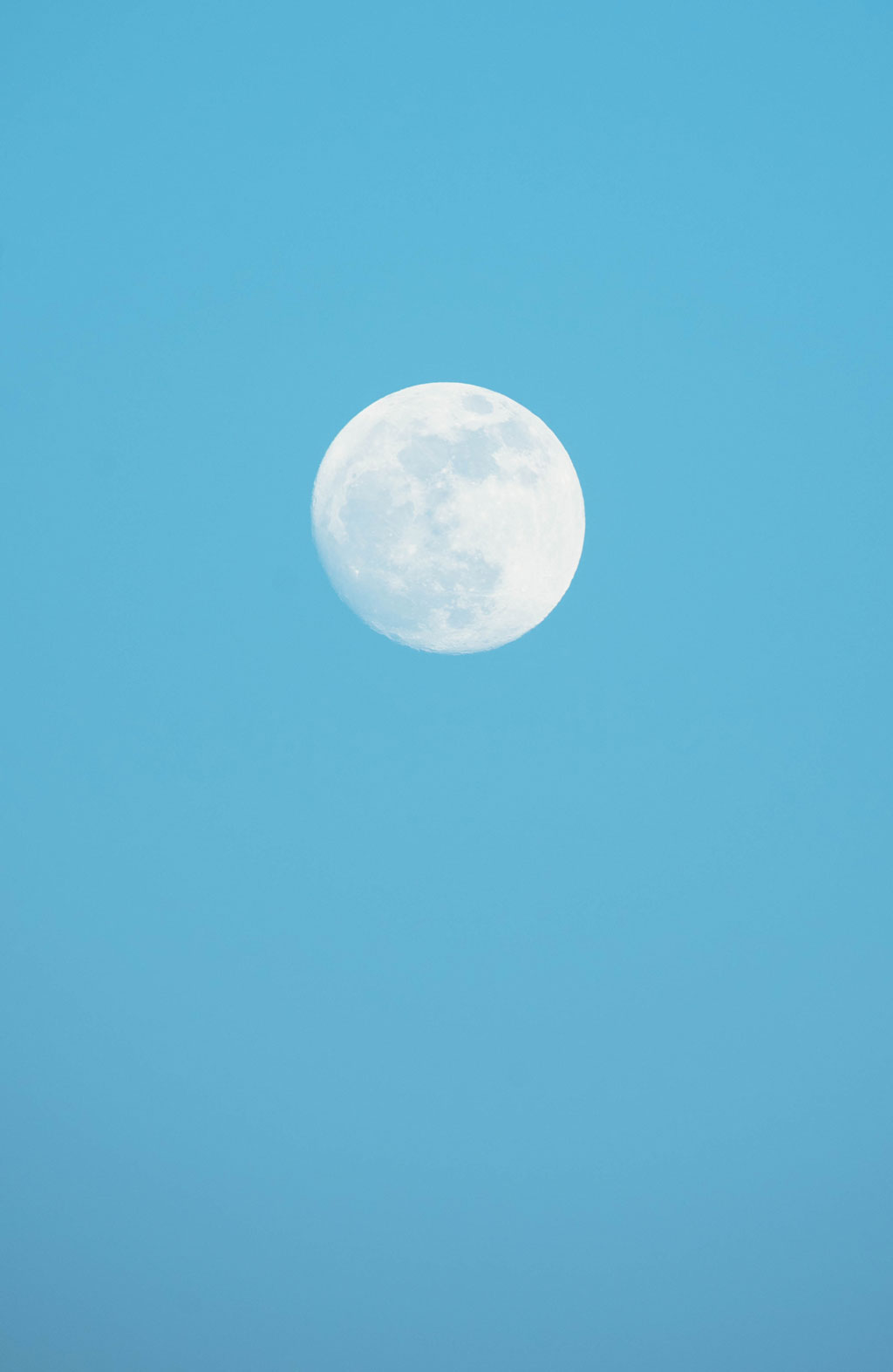 Moon against a blue sky
