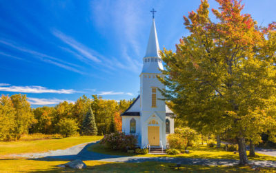 New England white church in autumn