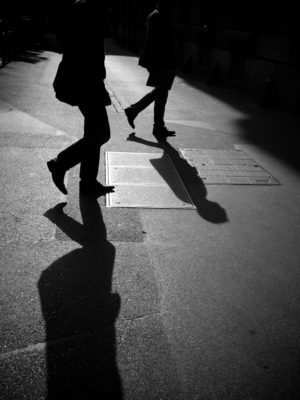 BW image of two figures with shadows
