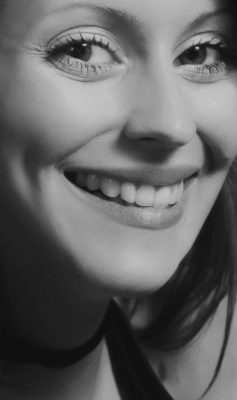 woman smiling broadly