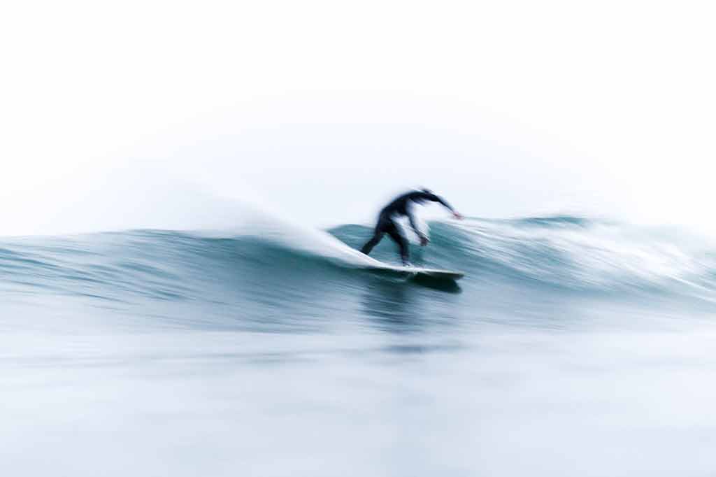 Long exposure shot of man surfing
