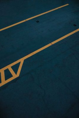 a parking lot space with yellow lines