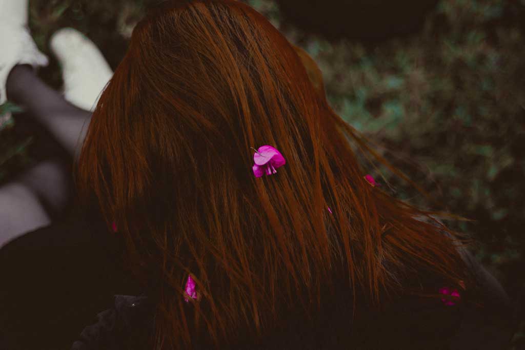long hair with flower petals