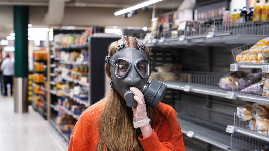 woman wearing a welding mask in supermarket